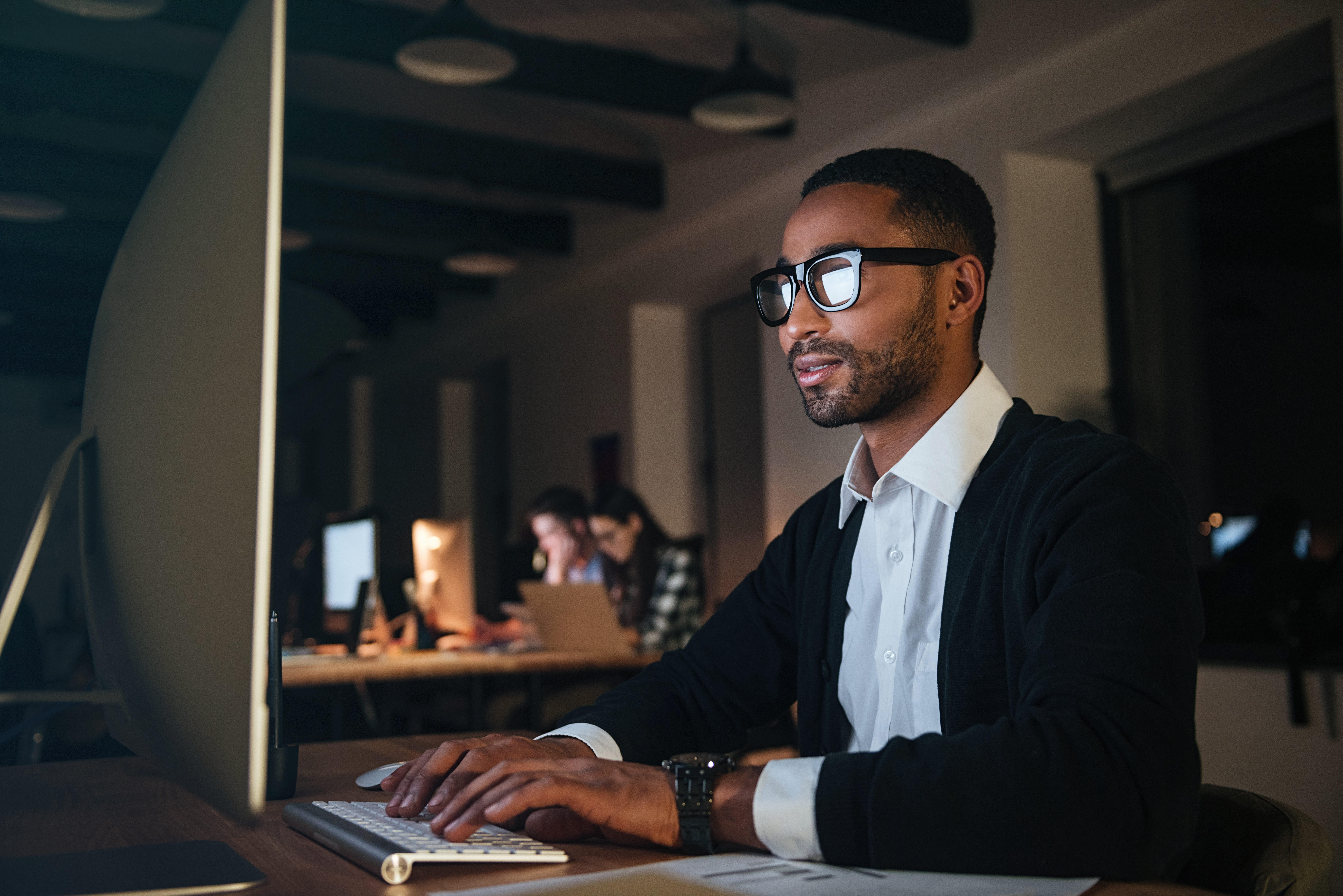 businessman-working-late-at-night-in-office-with-computer.jpg